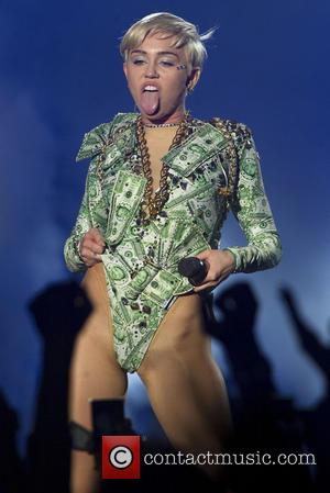 Miley Cyrus - Miley Cyrus performing during her Bangerz tour...