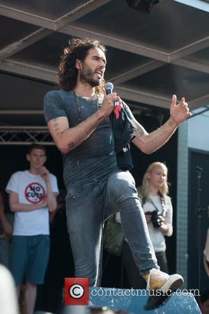 Russell Brand - Thousands march from London's Oxford Circus to Parliament Square to voice their dismay against the UK government's...