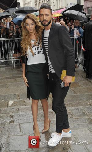 Nabilla Benettia and Thomas Vergara - Paris Fashion Week Haute Couture Fall/Winter 2014-2015 - Jean Paul Gaultier - Outside Arrivals...