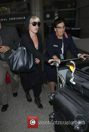 Pink and Alicia Moore - Pink (real name Alicia Moore) arrives at Los Angeles International Airport (LAX) wearing dark aviator...