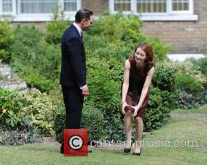 Tom Hardy and Emily Browning - Tom Hardy and Emily Browning on set of the film 'Legend' in East London...