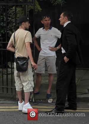 Tom Hardy and Adam Deacon - Tom Hardy shoots scenes for his latest film, 'Legend,' in Hackney. Tom joked around...