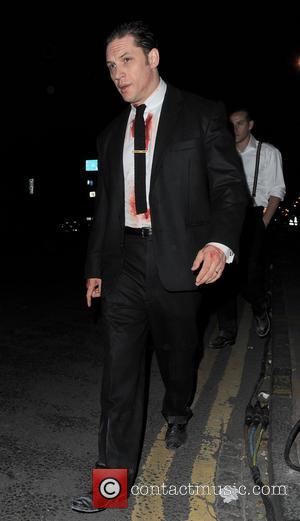 Tom Hardy - Tom Hardy covered in blood leaves the movie location at East London Canal after filming a winter...