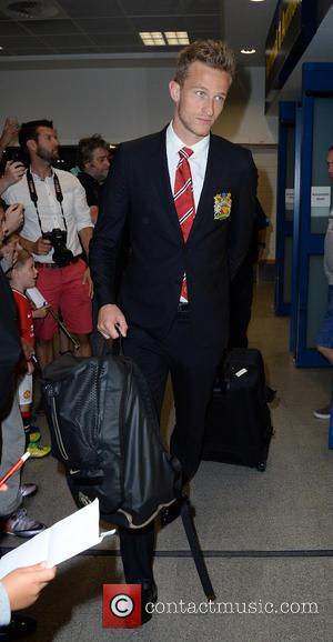 Anders Lindegaard - Manchester United Players arrive at Manchester Airport while a boax hoax drama was unfolding. - Manchester, United...