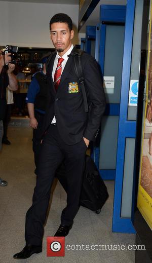 Chris Smalling - Manchester United Players arrive at Manchester Airport while a boax hoax drama was unfolding. - Manchester, United...