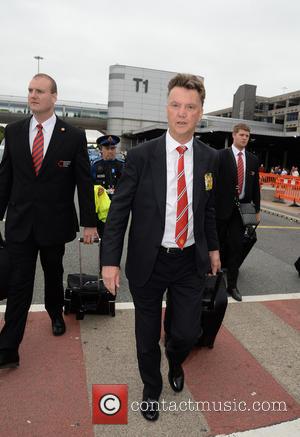 Louis van Gaal - Manchester United Players arrive at Manchester Airport while a boax hoax drama was unfolding. - Manchester,...