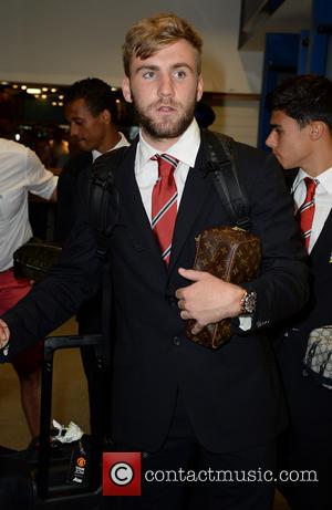 Luke Shaw - Manchester United Players arrive at Manchester Airport while a boax hoax drama was unfolding. - Manchester, United...