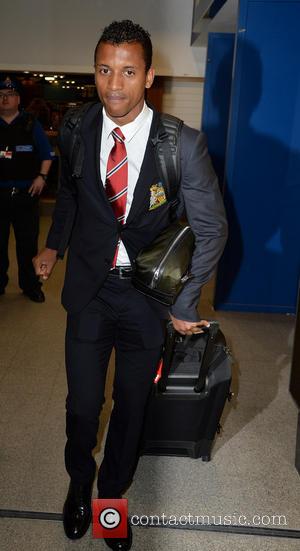 Nani - Manchester United Players arrive at Manchester Airport while a boax hoax drama was unfolding. - Manchester, United Kingdom...