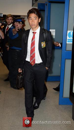 Shinji Kagawa - Manchester United Players arrive at Manchester Airport while a boax hoax drama was unfolding. - Manchester, United...