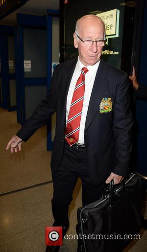 Sir Bobby Charlton - Manchester United Players arrive at Manchester Airport while a boax hoax drama was unfolding. - Manchester,...