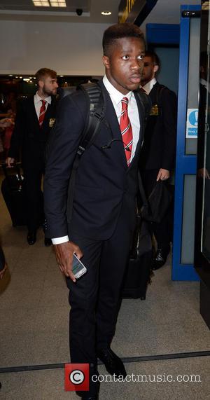 Wilfried zaha - Manchester United Players arrive at Manchester Airport while a boax hoax drama was unfolding. - Manchester, United...