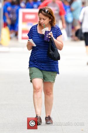 Rachel Dratch - Rachel Dratch, carrying a Starbucks iced coffee, spotted with her son Eli Benjamin walking around Soho in...