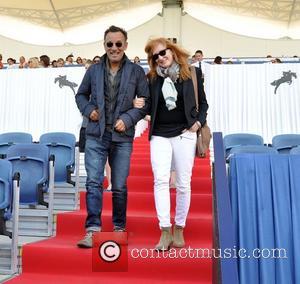 Bruce Springsteen and Patti Scialfa - Singer Bruce Springsteen and wife Patti Scialfa cheer on thier daughter Jessice Rae Springsteen...
