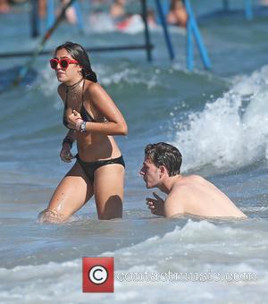 Lourdes Leon - Lourdes Leon, daughter of Madonna, spends time on the beach with a male companion during a summer...