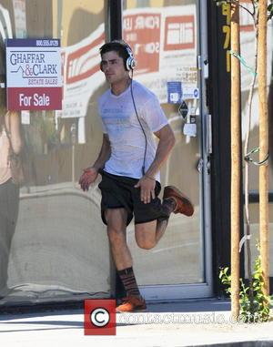 Zac Efron - Zac Efron works up a sweat on his first day on set of his new movie 