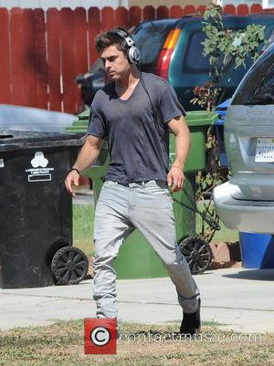 Zac Efron - Zac Efron shows off his biceps as he continues filming for his new movie 'We Are Your...