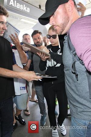 Iggy Azalea - Iggy Azalea signs autographs at Los Angeles International Airport (LAX) - Los Angeles, California, United States -...