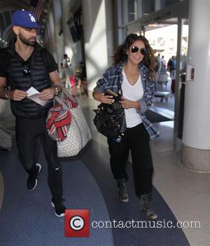 Emmanuelle Chriqui and Adrian Bellani - Emmanuelle Chriqui with her boyfriend Adrian Bellani depart from Los Angeles International Airport (LAX)...