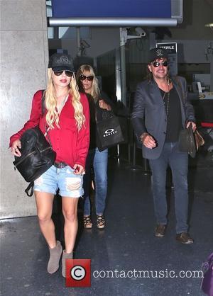 Richie Sambora and Orianthi Panagaris - Richie Sambora and his girlfriend Orianthi Panagaris arrive at Los Angeles International Airport (LAX)...