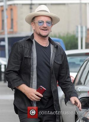 Bono - U2's Bono spotted walking to his car in Ballsbridge with what appears to be the new Apple iPhone...