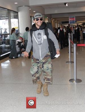 Clifton Collins Jr. - Pacific Rim star, Clifton Collins Jr. departs Los Angeles International Airport (LAX) in camouflage trousers -...