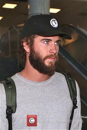 Liam Hemsworth - Liam Hemsworth arrives at Los Angeles International Airport (LAX) sporting a beard - Los Angeles, California, United...