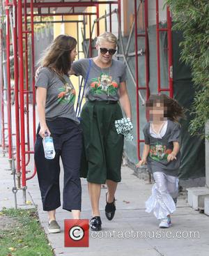 Busy Philipps - Cougar Town star Busy Philipps out in West Hollywood with family all wearing matching grey t-shirt portraying...