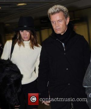 Billy Idol - Rock star Billy Idol arriving at Dublin Airport holding hands with a mystery woman who doesn't appear...