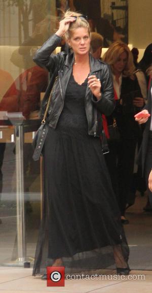 Rachel Hunter - Rachel Hunter goes shopping at The Grove in Hollywood dressed all in black with a leather jacket...