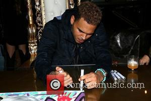 Chris Brown - Chris Brown and Karen Bystedt Exclusive Serigraph Signing Benefit Symphonic Love Foundation at Guerilla Atelier Clothing Store...