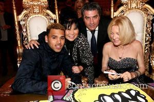 Chris Brown, Sonia Ete, Thierry Ete and Karen Bystedt - Chris Brown and Karen Bystedt Exclusive Serigraph Signing Benefit Symphonic...