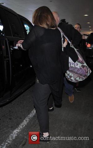 Adele - Adele arrives at Los Angeles International (LAX) airport carrying her son Angelo - Los Angeles, California, United States...