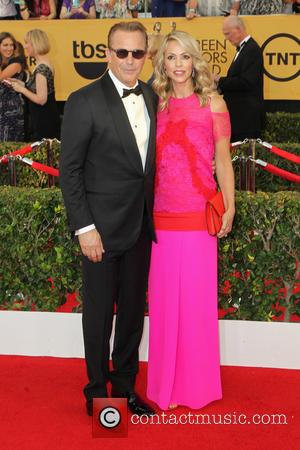 Kevin Costner and Christine Baumgartner - A host of stars were photographed on the red carpet as they arrived at...