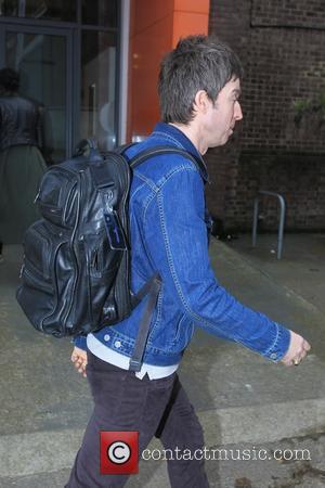 Noel Gallagher - Noel Gallagher former guitarist of Oasis and now High Flying Birds walks to a TV studio carrying...