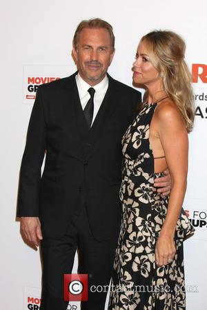 Kevin Costner and Christine Baumgartner