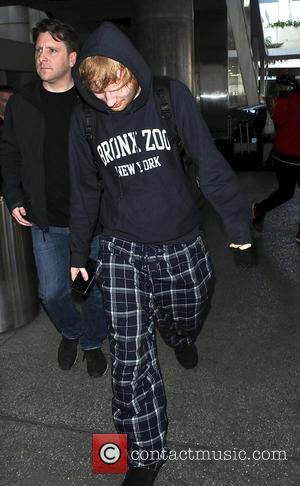 British singer songwriter Ed Sheeran was spotted wearing pyjama bottoms as he arrived in to Los Angeles International Airport in...