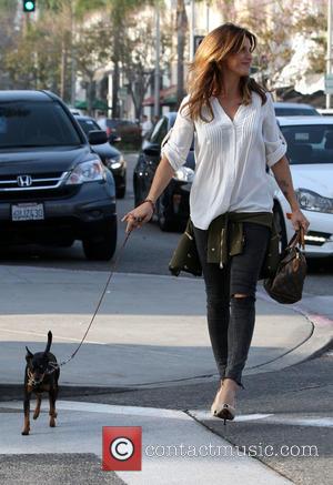 elizabetta canalis - Elisabetta Canalis walking her pet dog in high heels after having lunch with a pal gal at...