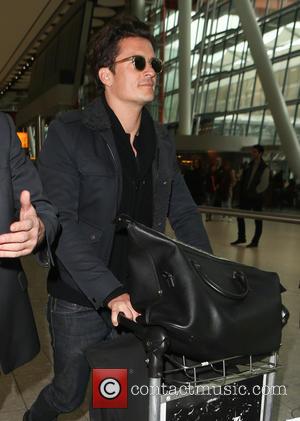 Orlando Bloom - Eddie Redmayne and wife Hannah Bagshawe, Orlando Bloom and Mark Ronson arrive at Heathrow Airport - London,...