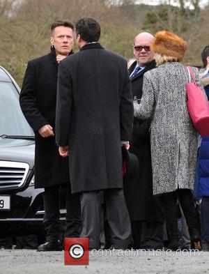 Larry Mullen Jr. and Paul McGuinness - The Funeral of Rev.Jack Heaslip at St.Mary's Church Howth. Rev.Heaslip was U2's chaplin...