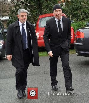 The Edge - The Funeral of Rev.Jack Heaslip at St.Mary's Church Howth. Rev.Heaslip was U2's chaplin and travelled around the...