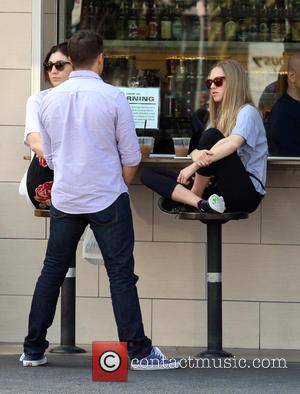 Amanda Seyfried - Amanda Seyfried having lunch with friends in Los Feliz and having a drink perched crossed legged on...