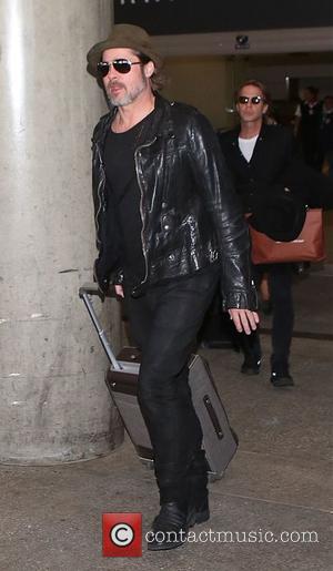 Brad Pitt - Brad Pitt arrives at Los Angeles International Airport (LAX) - Los Angeles, California, United States - Friday...