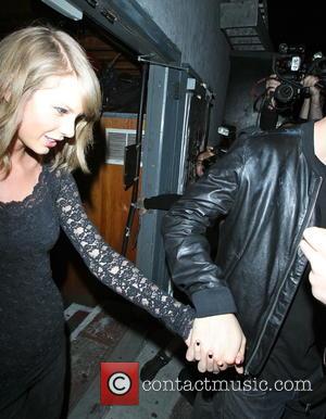 Taylor Swift and Calvin Harris Seal Relationship Status with Hand-Holding Photos