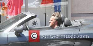 Matthew Perry - Matthew Perry smokes a cigarette while driving in his gun metal Audi R8 in Beverly Hills -...