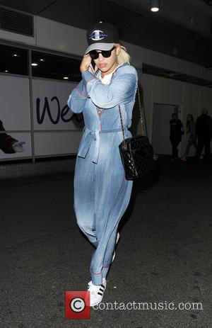 Rita Ora - Rita Ora arrives at Heathrow Airport after flying in from Hong Kong. Rita was wearing typically wacky...