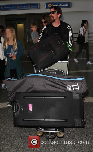 Christian Bale , Emmeline Bale - Christian Bale and family arrive on a flight to Los Angeles International Airport (LAX)...