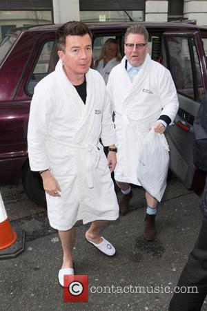 Rick Astley - Rick Astley pictured arriving at the Radio 2 studio in a white towel dressing gown at BBC...