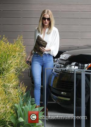 Rosie Huntington-Whiteley - A stylishly dressed Rosie Huntington-Whiteley arrivng at an office building in Beverly Hills - Los Angeles, California,...