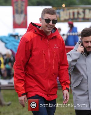 Professor Green was one of the many celebrities seen wandering around backstage on the first day of Glastonbury Festival 2016...