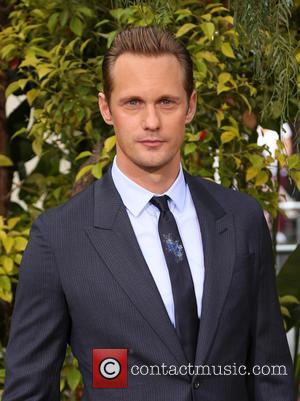 Actor Alexander Skarsgard poses alone and with his lead co-star Margot Robbie at the premiere of 'The Legend Of Tarzan'...